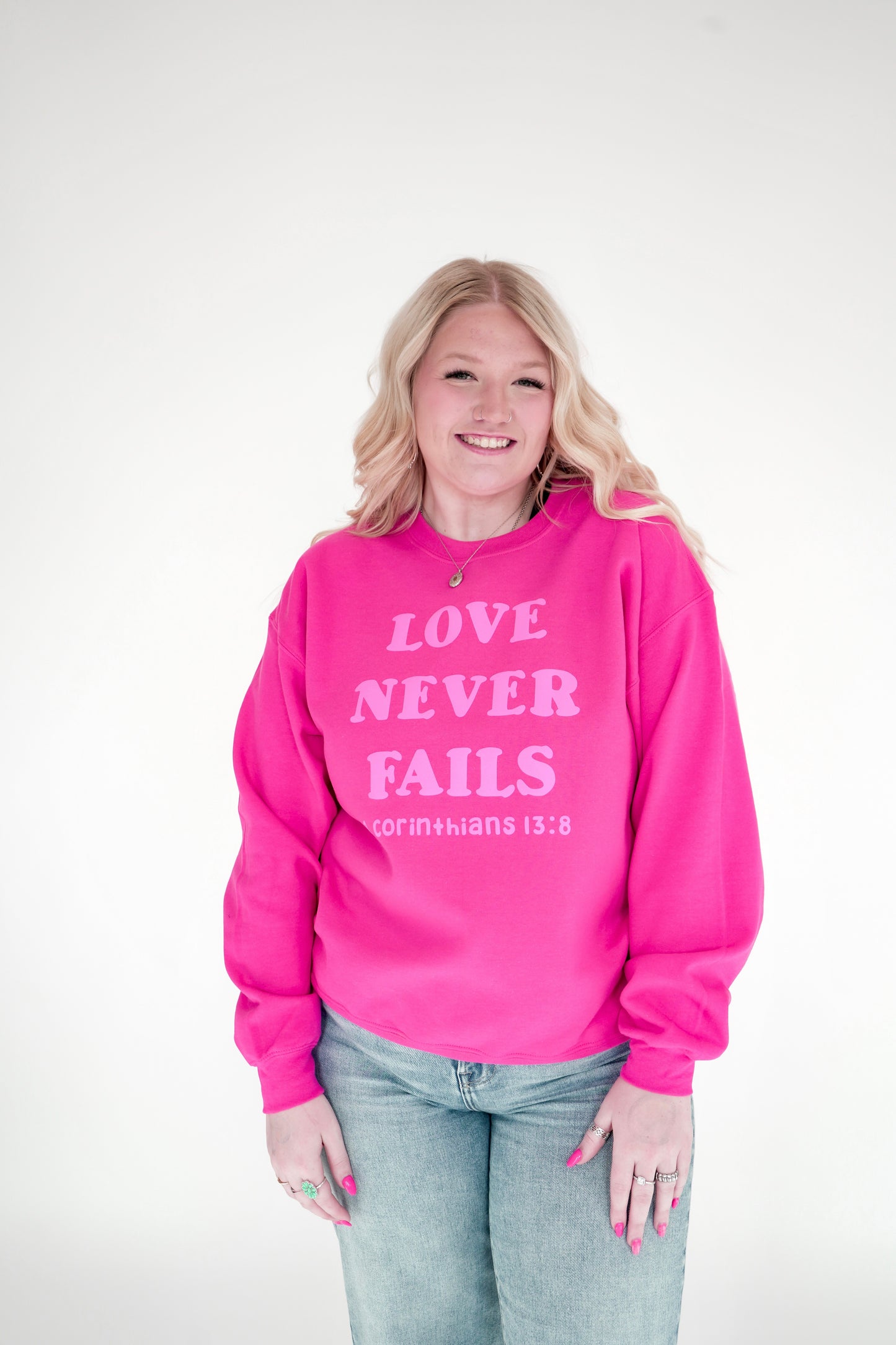Love Never Fails Crewneck