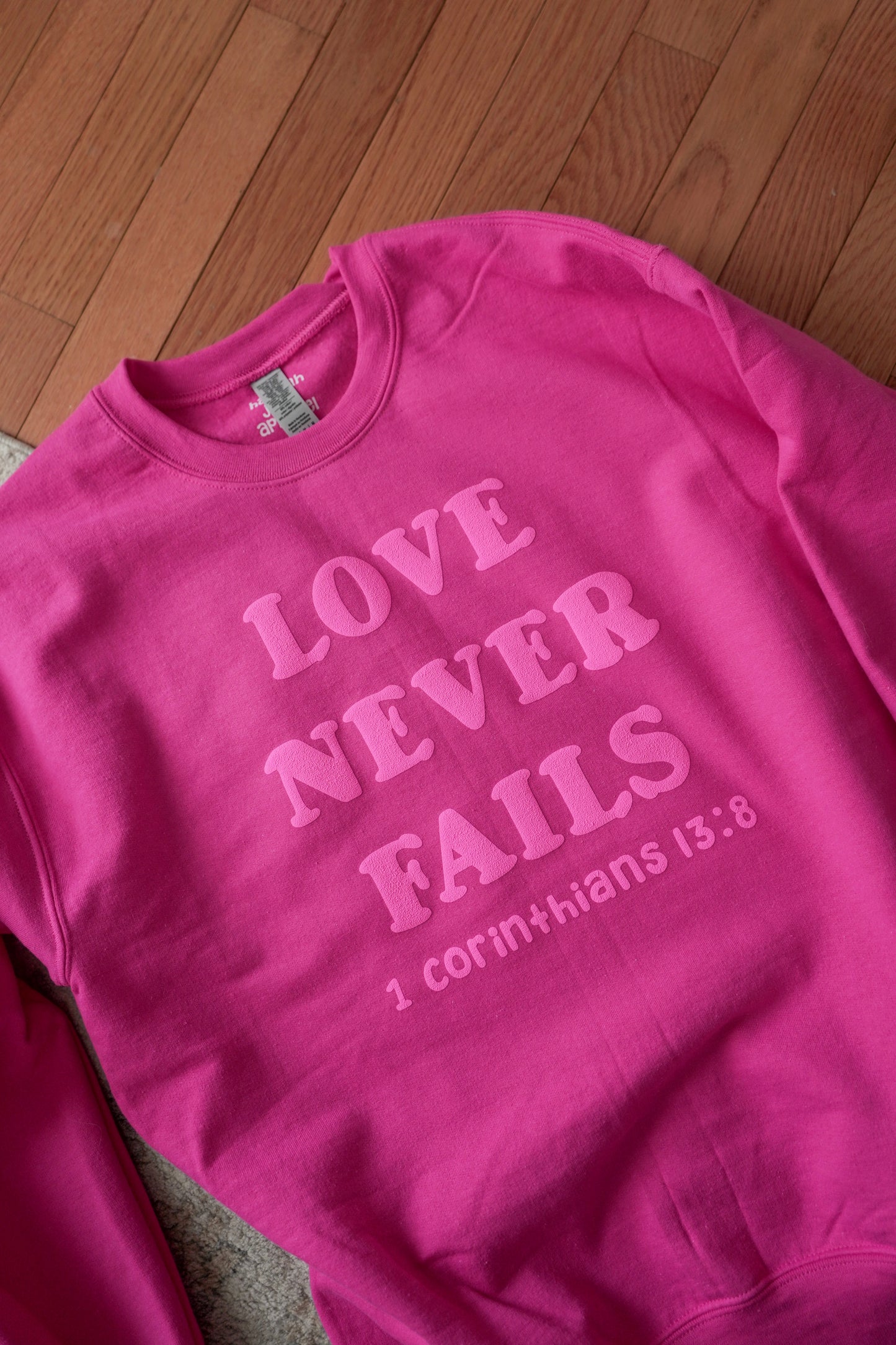 Love Never Fails Crewneck
