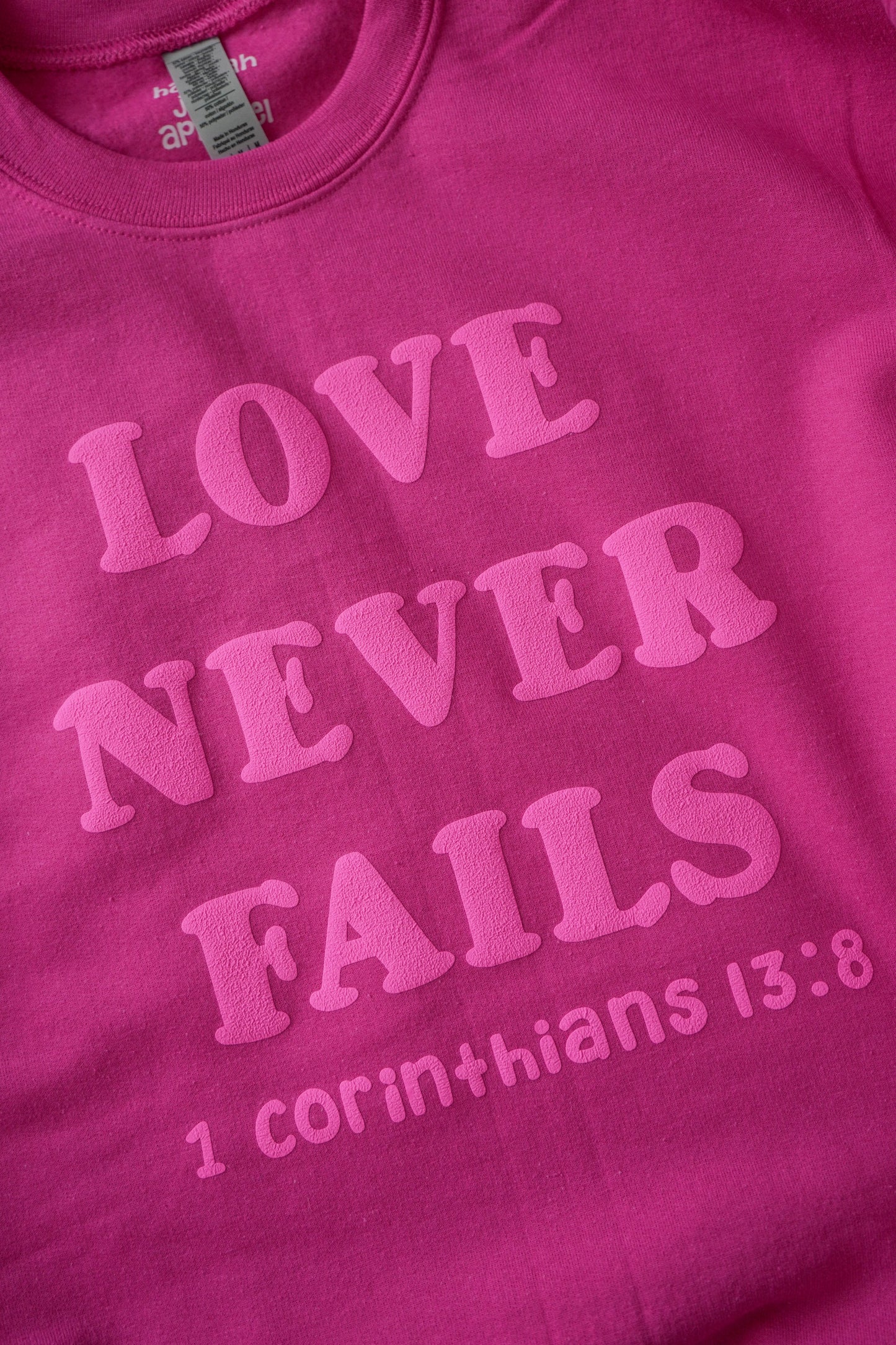 Love Never Fails Crewneck